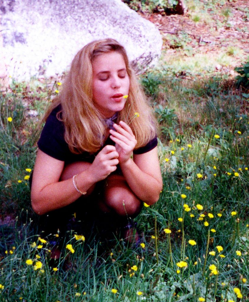 Young woman and dandelion, photo by Bela Johnson